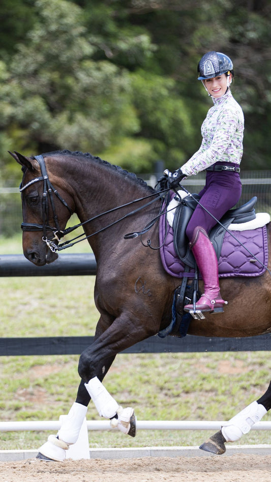 Advanced dressage rider cantering with good contact